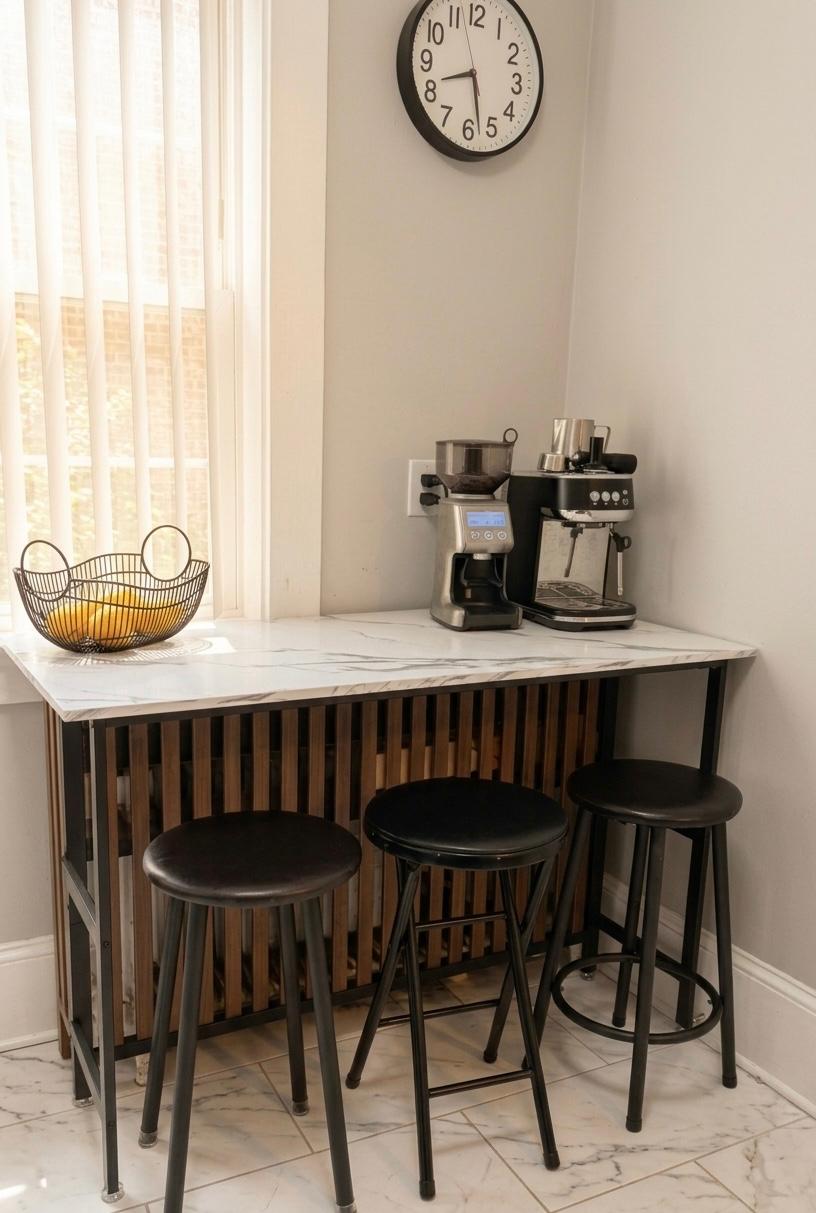 Kitchen island with bar stools and espresso setup